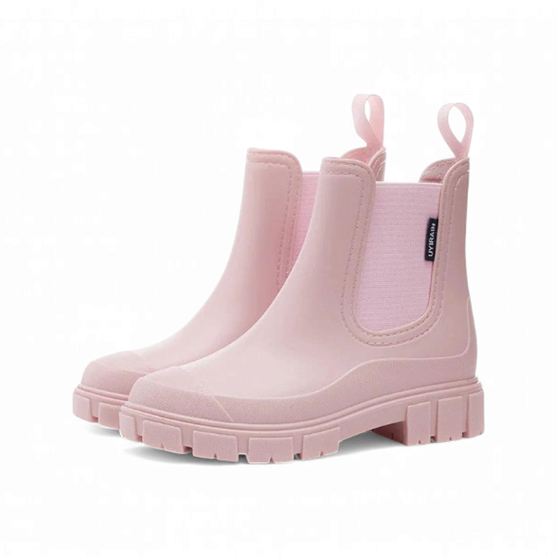 Light pink chunky Chelsea boots placed side by side at a front angle.