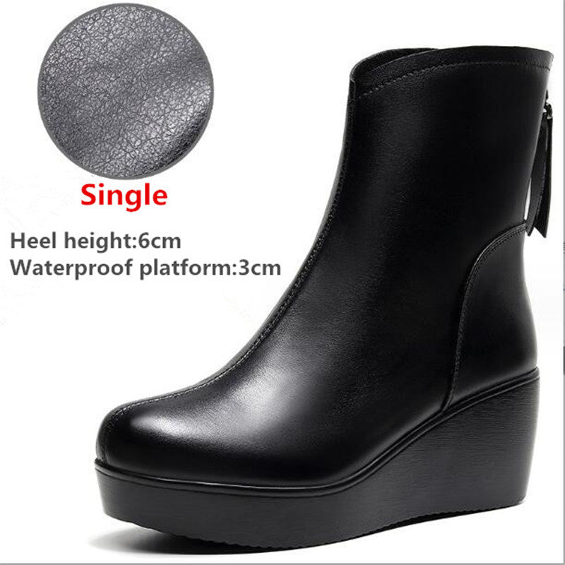 Side view of a black wedge ankle boot with a 6cm heel, featuring a circular callout labeled "Single Plush" highlighting the inner lining, shown against a white background.