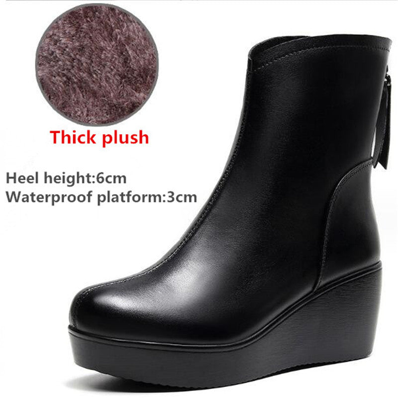 Side view of a black wedge ankle boot with a 6cm heel, featuring a circular callout labeled "Thick Plush" highlighting the inner lining, displayed on a white background.