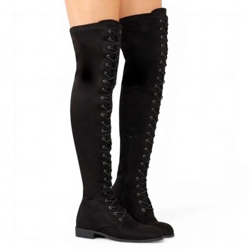 Black over-the-knee lace-up boots shown worn by a model