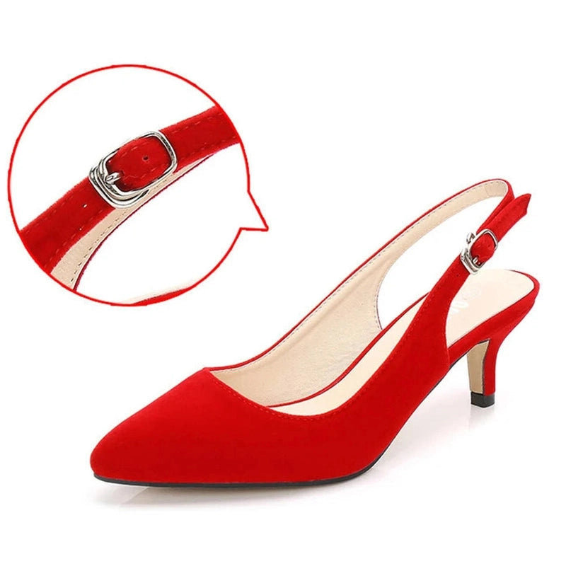 Detail of silver buckle strap on red slingback