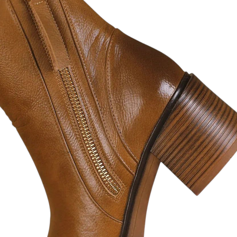 Wide stacked heel and metallic side zipper on brown leather boot