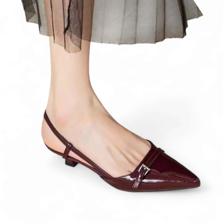Front angle showing a woman wearing glossy burgundy slingback pumps with pointed toes and smooth finish.