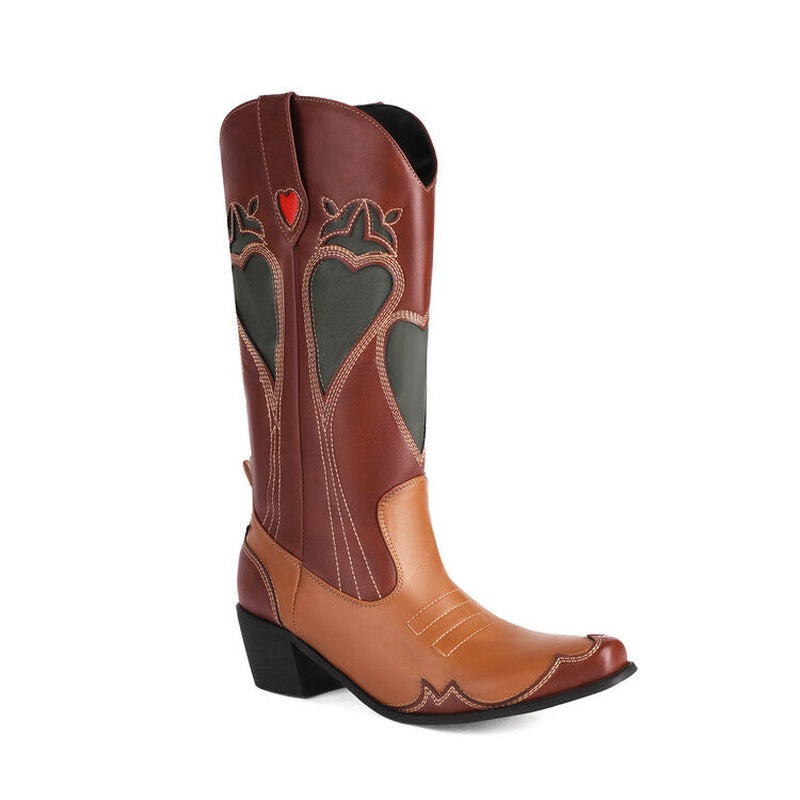 Full product shot of two-tone chocolate boot with cut-out heart shapes.