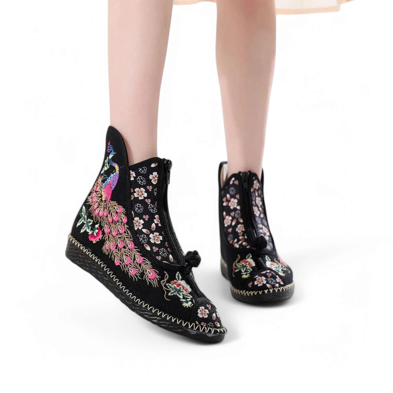 Black cotton boot with pink peacock and white blossoms, worn with light dress.