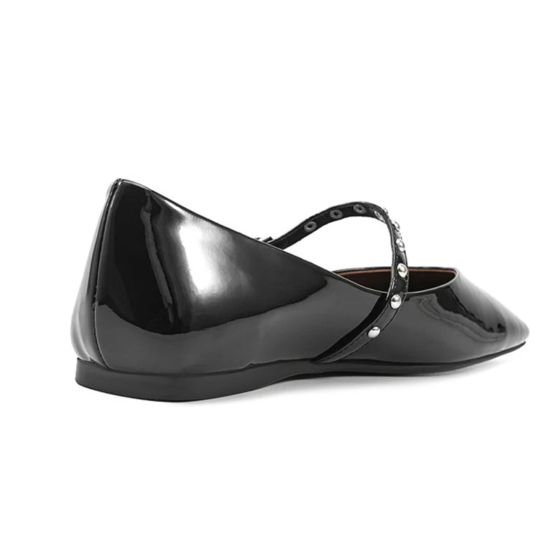 Rear three-quarter view highlighting the low flat heel and crossing instep strap.