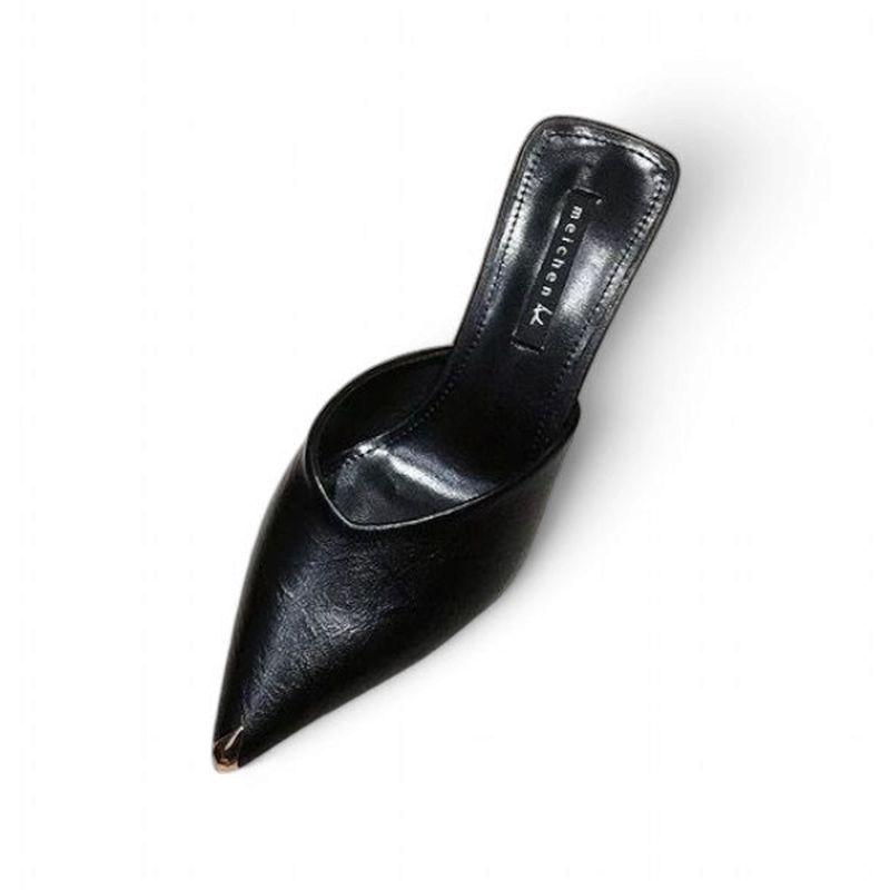 Black PU slide with metal‑tipped pointed toe on white background, angled top view