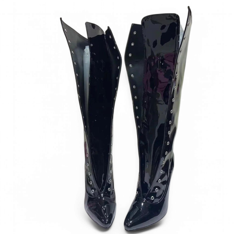 A pair of glossy black knee-high boots shown from the front with open lace-up details