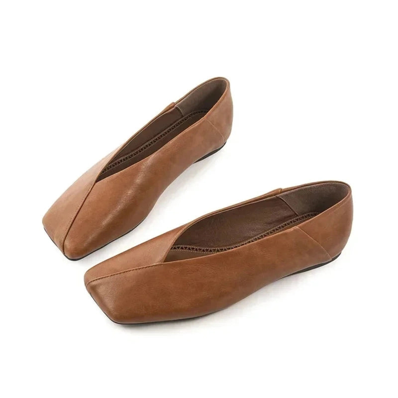 Pair of camel square-toe microfiber flats on white background