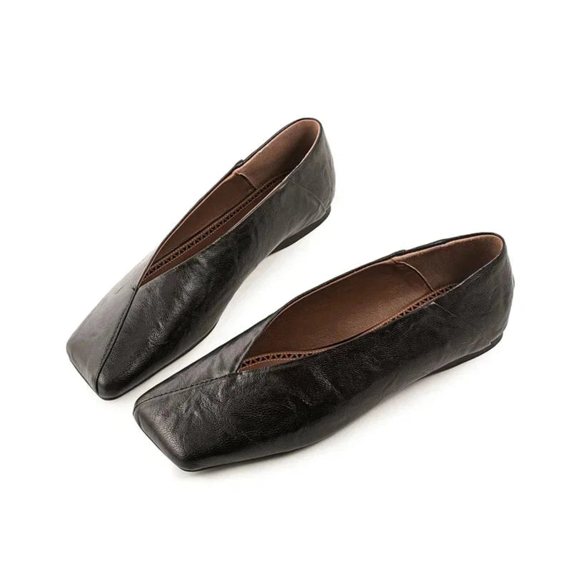 Dark-brown square-toe flats on white background