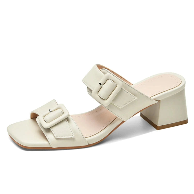 Right-side shot of the cream sandal showing the block heel and cushioned footbed.