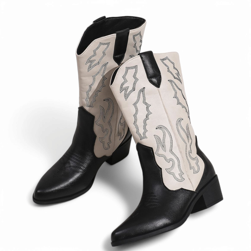 Two-tone black & cream cowboy boots with contrast stitching and mid block heels, front three-quarter view.
