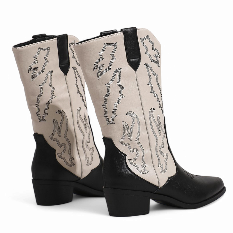 Side-rear shot showing embroidered shaft and medium stacked heel.