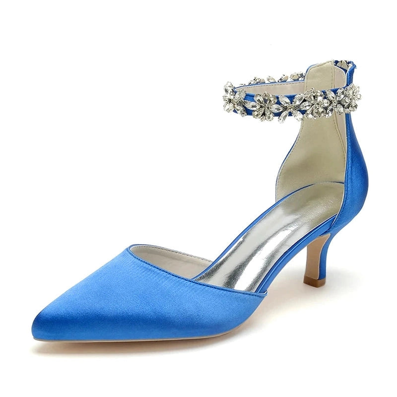 Royal-blue satin pump with pointed toe, 5 cm kitten heel and floral crystal ankle strap.