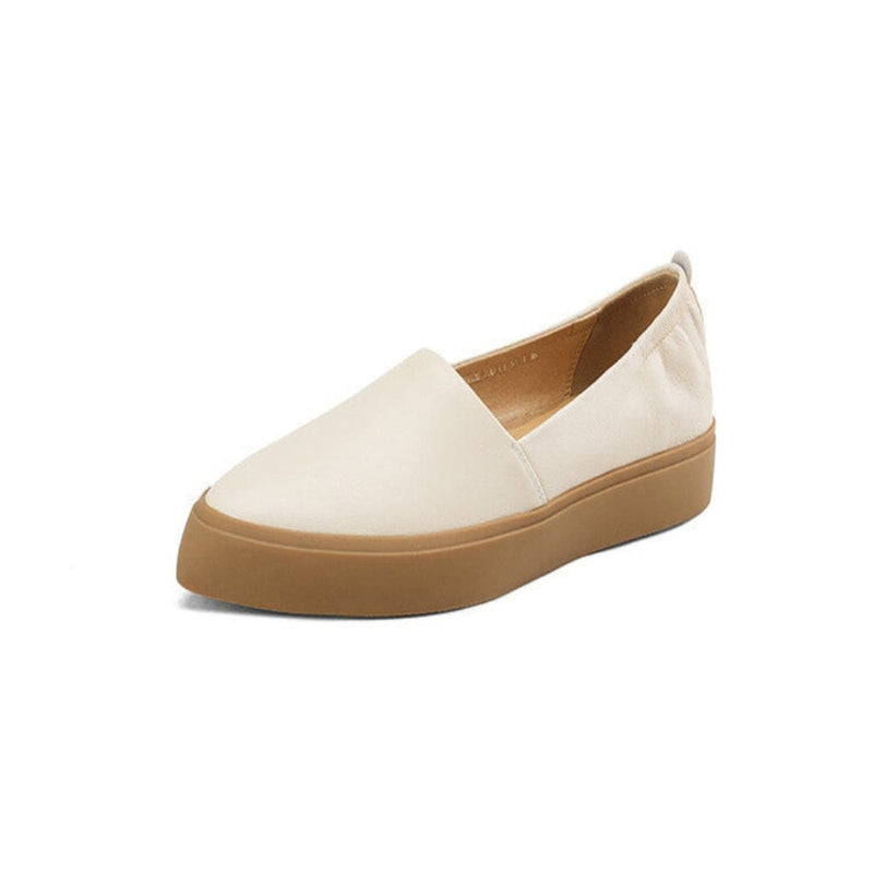 Single cream‑beige loafer with caramel sole on white background