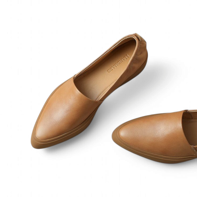 Close‑up top view of camel‑tan loafer showing pointed vamp