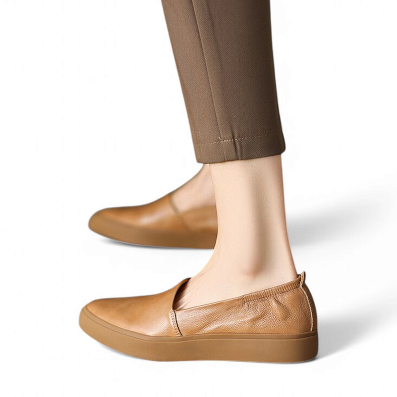 Camel loafer on model’s foot, elasticated heel visible, side view