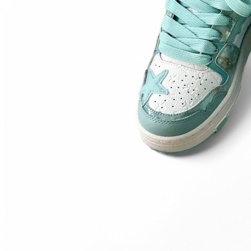 Close-up highlighting the blue star stitched on the perforated toe.