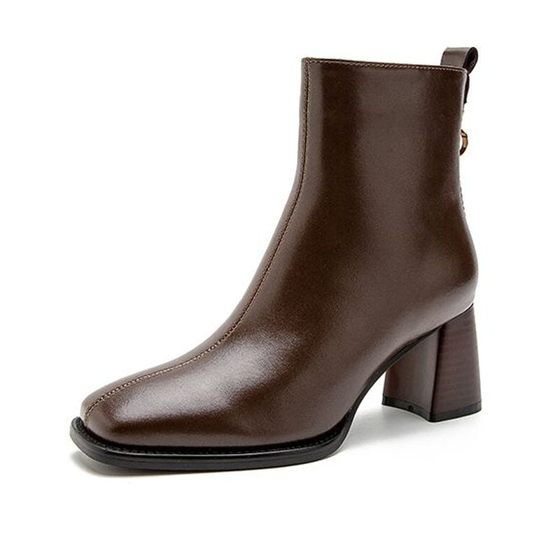 Brown leather boot with mid block heel shown side-on against white background.