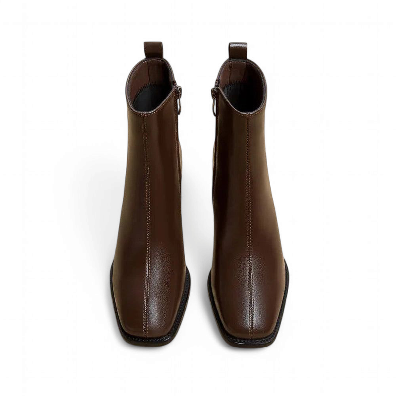 Top view of brown boot showing square toe and central seam.
