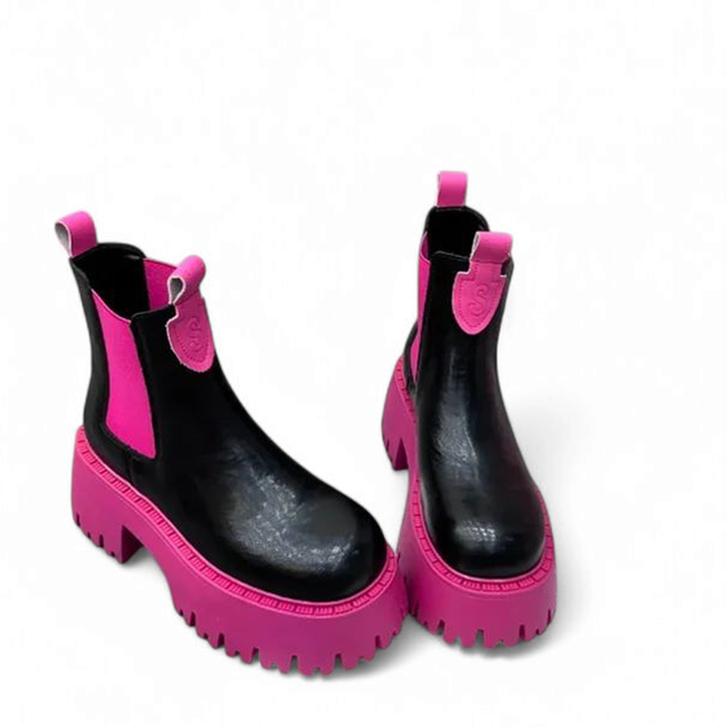 A pair of black Sara chunky Chelsea boots with pink soles and side elastic panels on a white background.