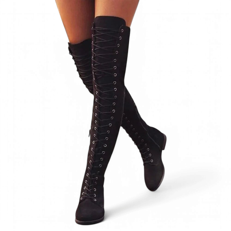 Purble lace-up over-the-knee boots worn on both legs