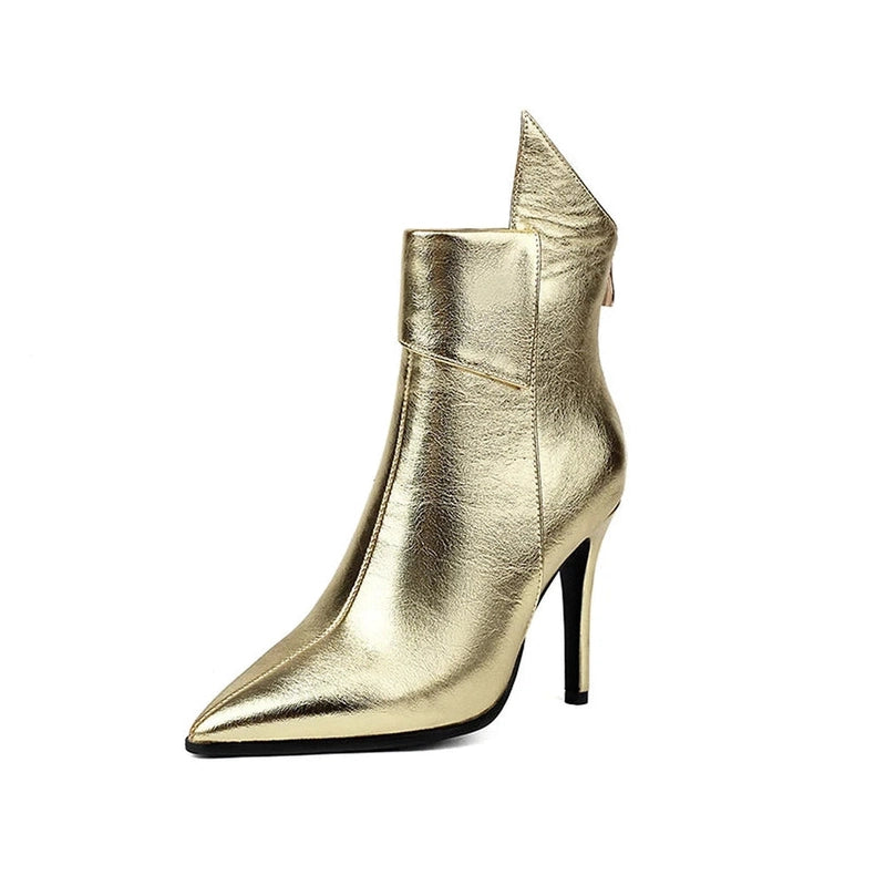 Studio shot of gold chrome boot, pointed toe facing forward.