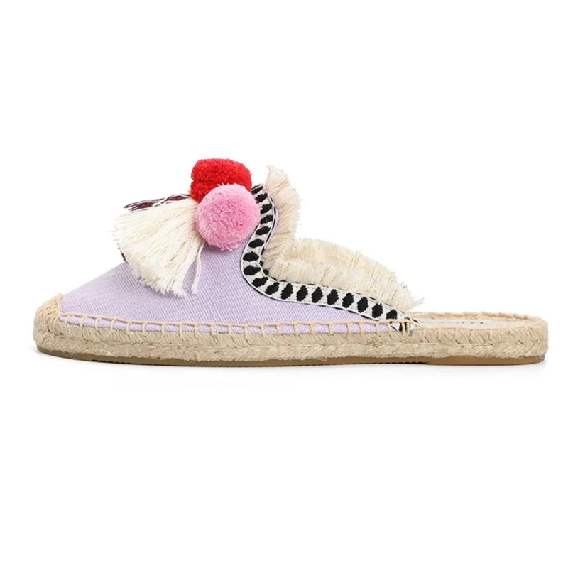 Side profile of lilac tasselled mule on jute sole