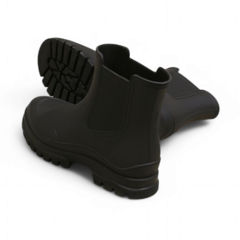 Back and bottom view of the black waterproof Chelsea boots highlighting the rugged tread and rubber finish.