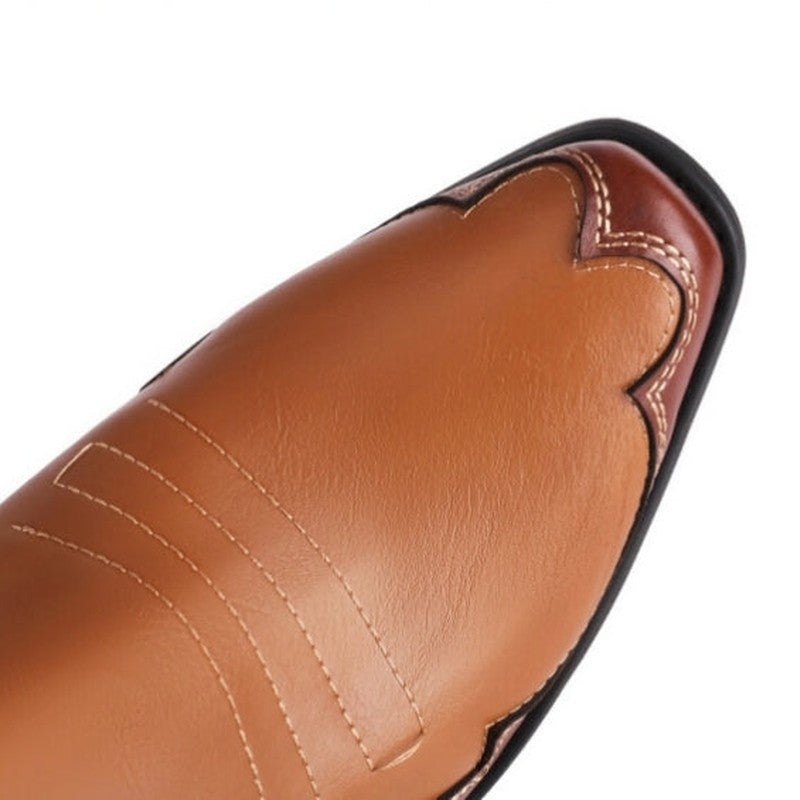 Close-up of square toe with decorative stitching and black welt.