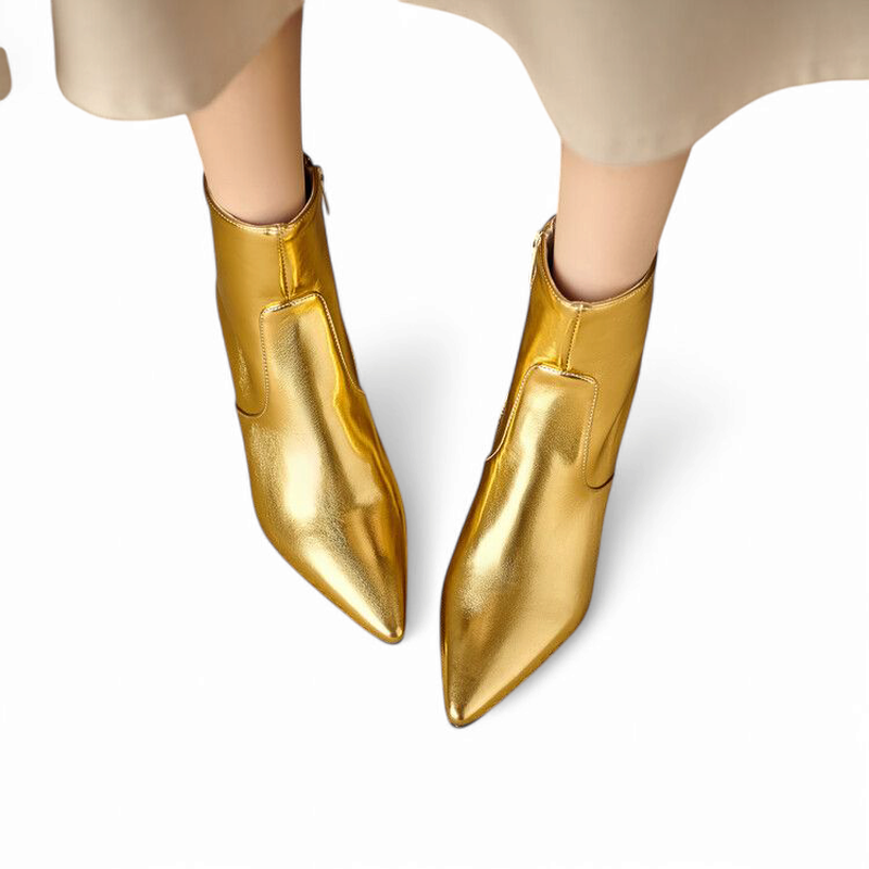 Top-down shot of gold boots pointing forward.