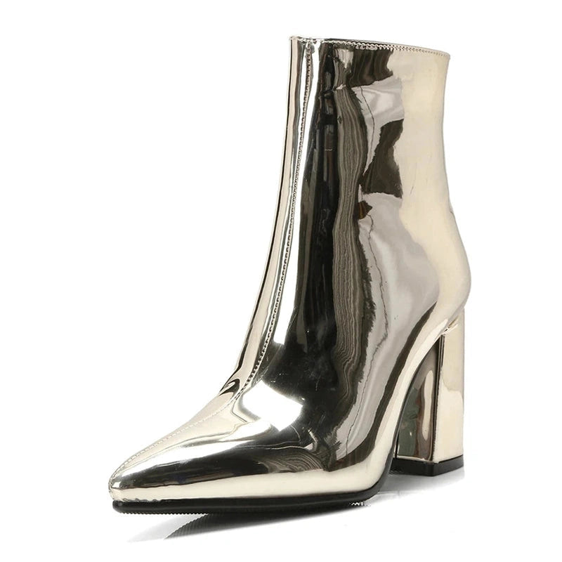 Front-angled shot of gold mirror boot, chunky heel visible.