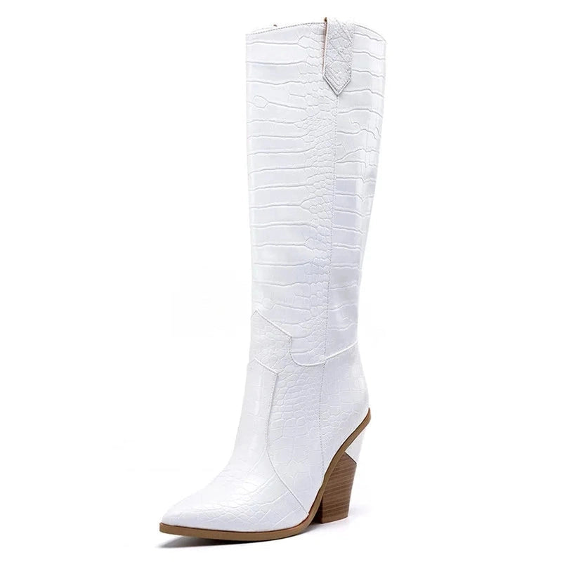 Side view of a white knee-high boot with crocodile texture.