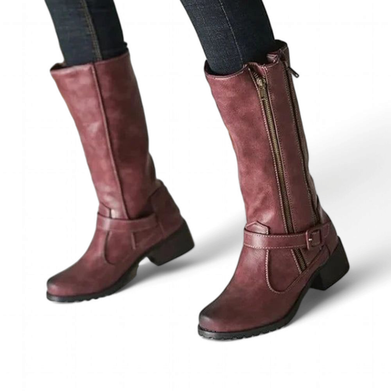 A woman wearing the wine red boot with jeans, showing a relaxed, chic look