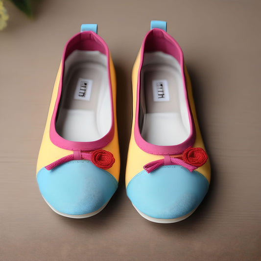Multicolored ballet flat in yellow, pink, and blue with a small flower and bow on the front, playful and modern design