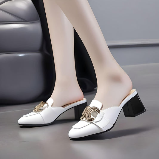 White mid-heeled mule with wide block heel and interlocked circular metal ornament