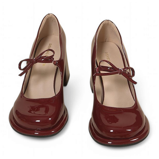 Angled side view of glossy burgundy Mary-Jane pair with high chunky heels and front tie.