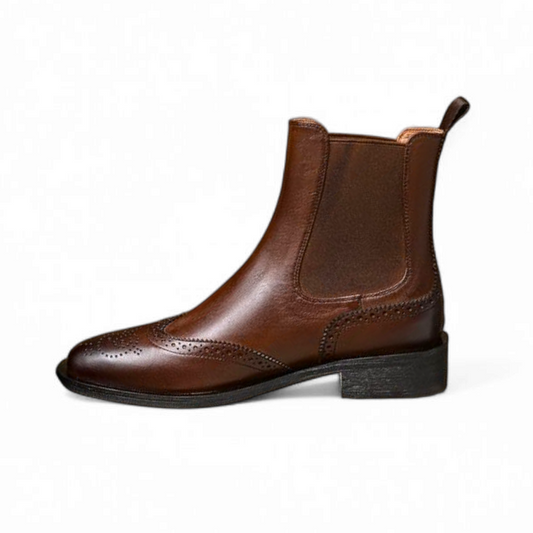 Side profile of a brown Chelsea boot showing the shaft and heel