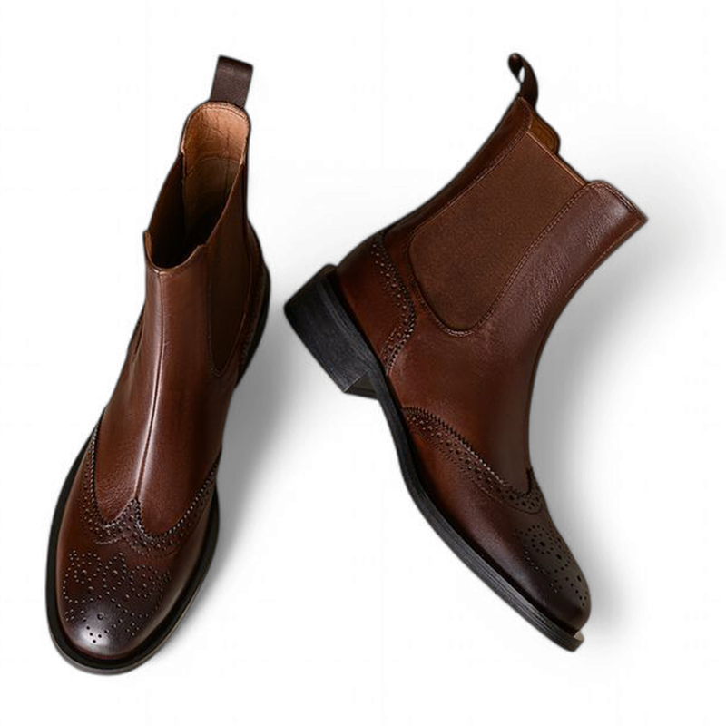 Brown Chelsea boots overlapping pair with distinct angle presentation