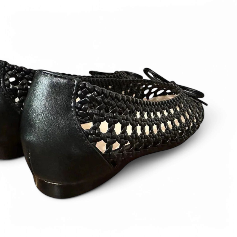 Low heel and leather-wrapped back with open black mesh sides.
