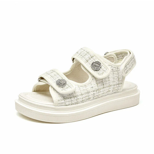 Ivory version of Atleta sandal in side view, showing hook-and-loop straps and foam midsole