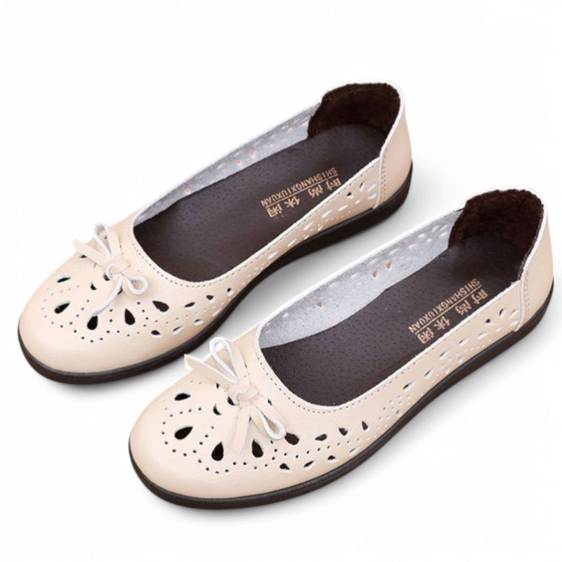 Top-down beige pair showing inner lining and white bows.