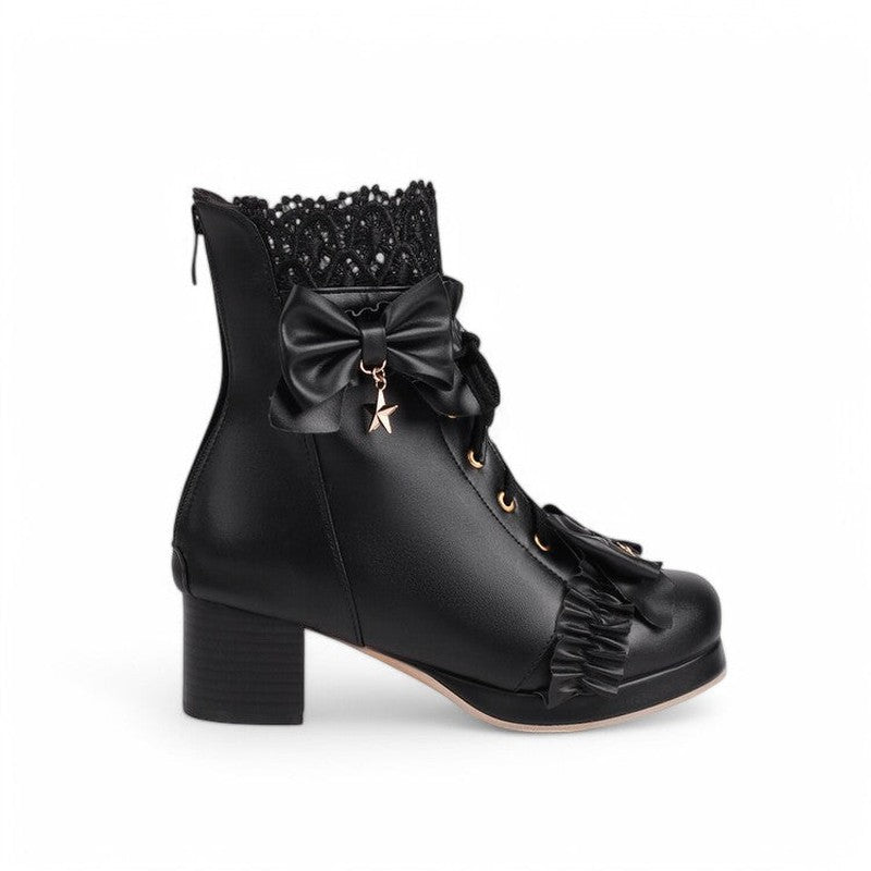 Elegant black Victorian ankle boots with round toe, block heel, lace-up closure with gold eyelets, satin bow with gold star charm, ruffled toe detailing, and hidden side zipper.