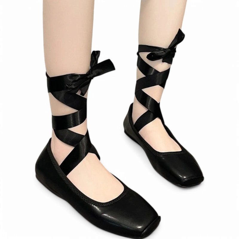 Satin ribbon criss-crossing the ankle with square-toe flat shoe.