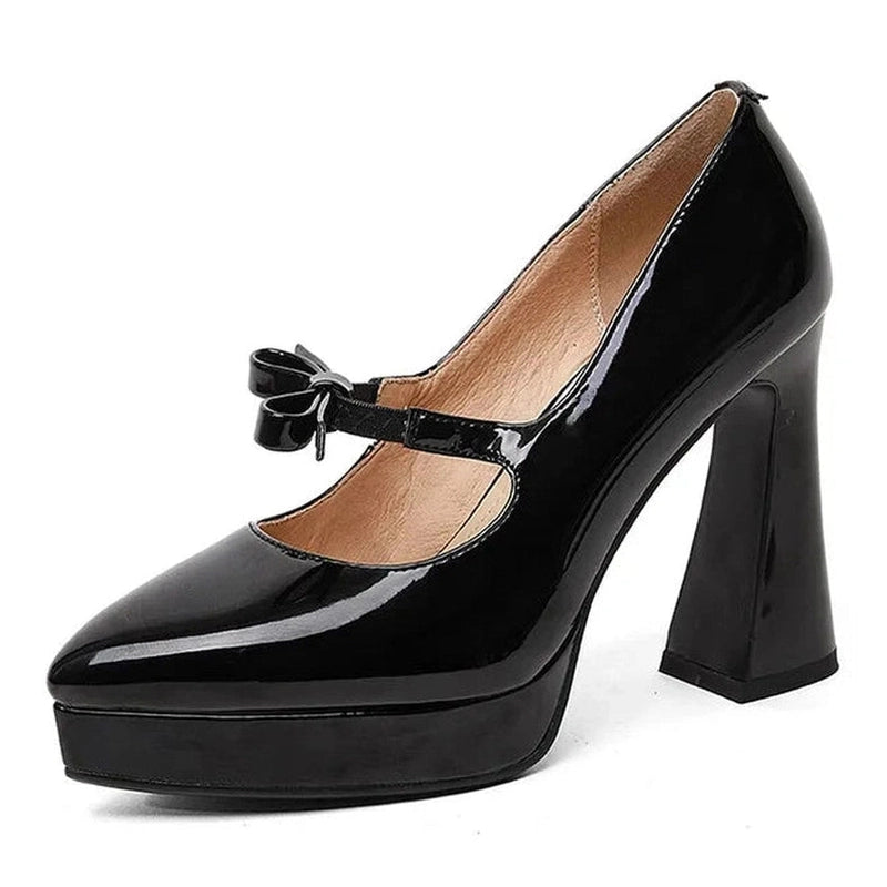 Glossy black Mary-Jane pump with chunky heel and platform, three-quarter view.