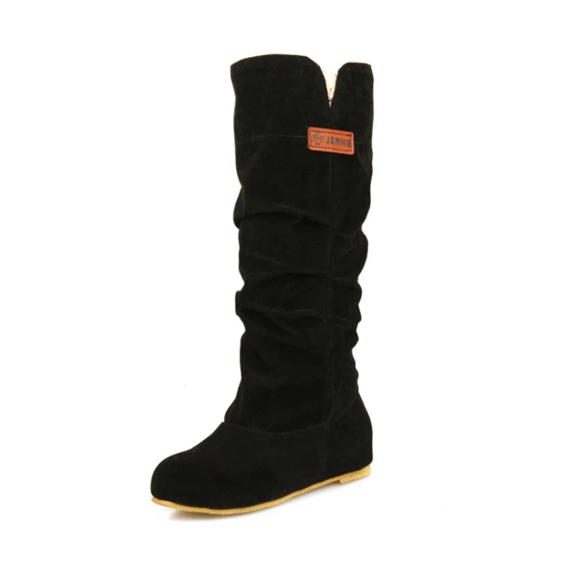 Matte black suede boots featuring subtle side detail and soft texture