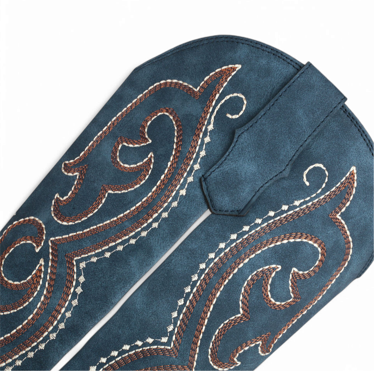 Close-up showing brown-and-cream stitching on deep-blue faux leather.

