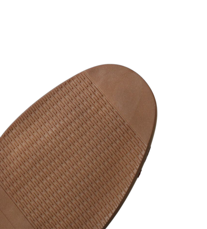 Brown rubber outsole with textured grip pattern