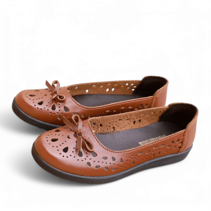 Brown pair in angled view showing perforated side panels and sole.