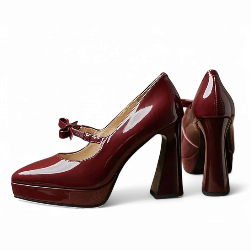 Two burgundy Mary-Jane pumps with chunky heels and front platform, side view.